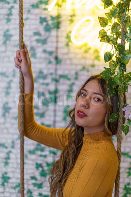 face details with makeup and red lips of a young latin woman