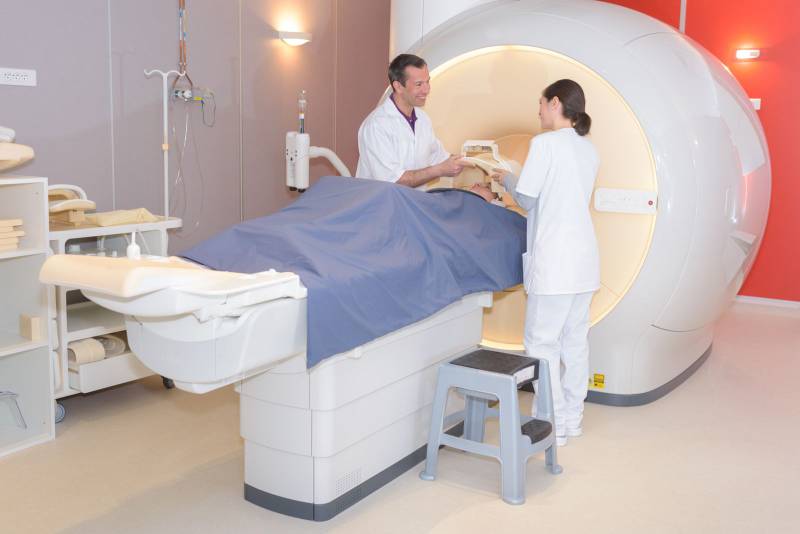 Colleagues and patient before mri scan | Colourbox