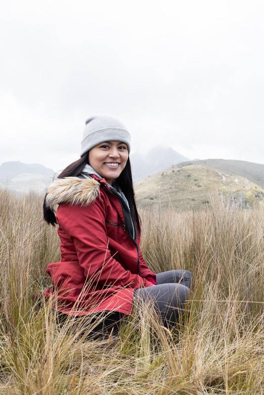 young latin woman wearing a wool cap, jacket for the cold, winter clothes in the countryside