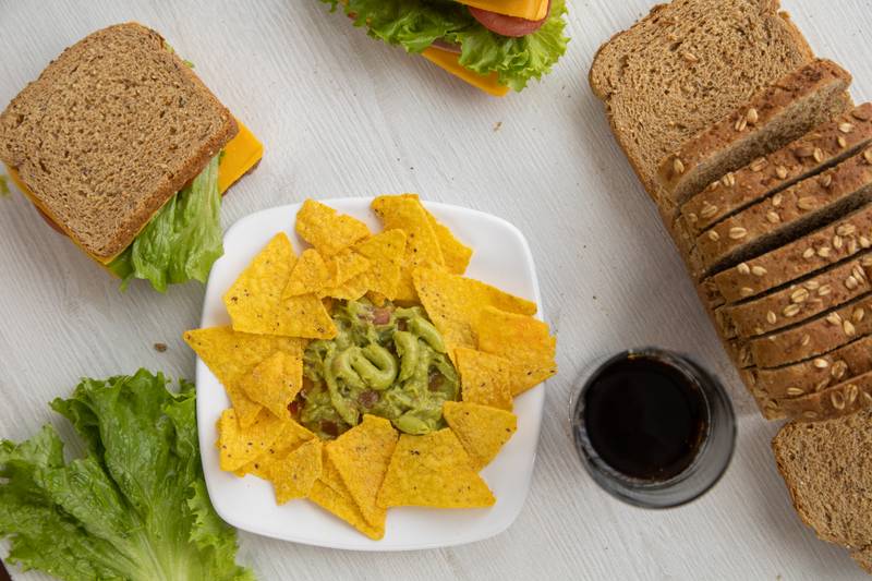 menu, restaurant table with several sandwiches