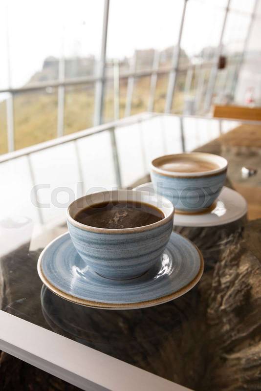 cup of coffee and latte, light blue decorated crockery, hot drink