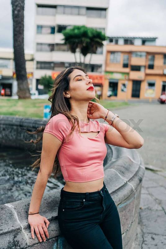 woman standing enjoying the sun in the day