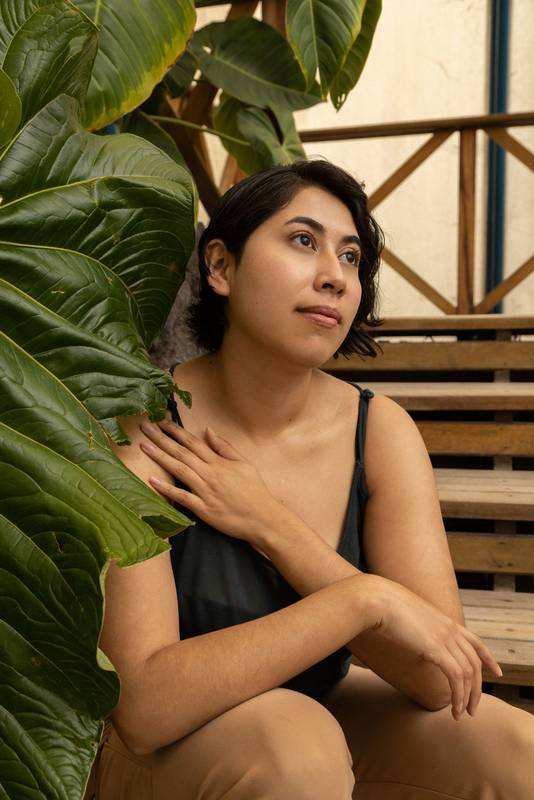 young latin woman with short black hair, beauty and nature