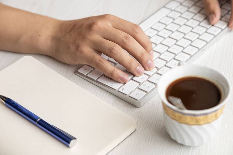 lifestyle in the workplace, hands of a person typing on a keyboard