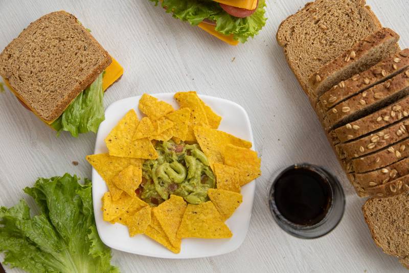menu, restaurant table with several sandwiches
