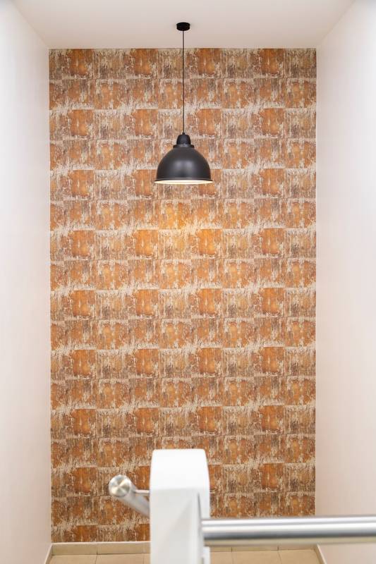 room with a modern pendant lamp turned on, decorating a room