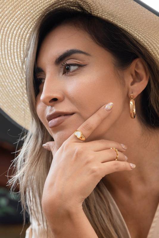 cheerful face of a young woman with long hair with natural makeup