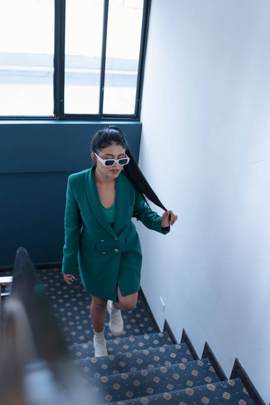 walking up some stairs a young woman