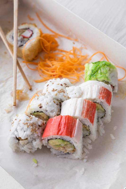 eatinf sushi, packaging in a cardboard box