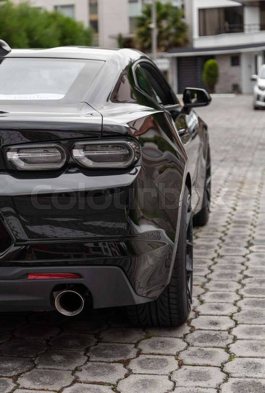 details of the rear of a black sports car