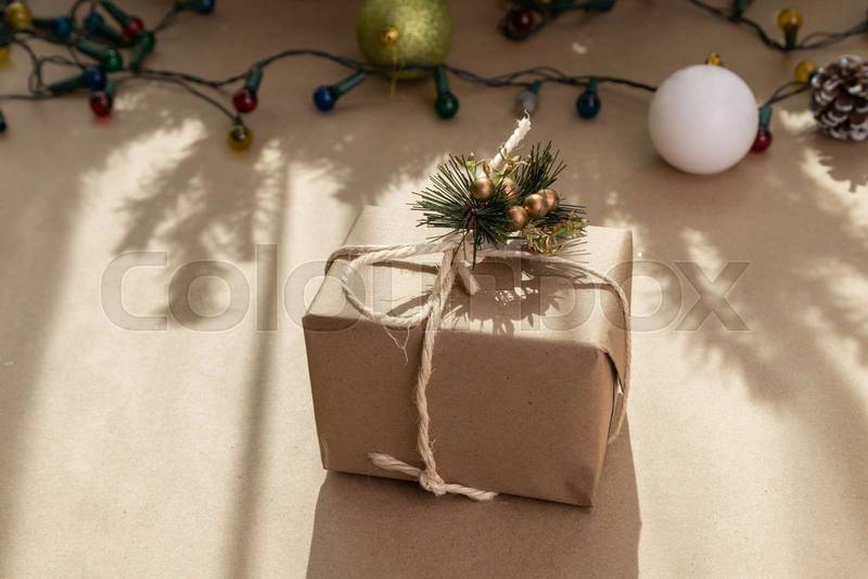 gift in the form of a box with a bow and christmas decoration, beauty in sharing