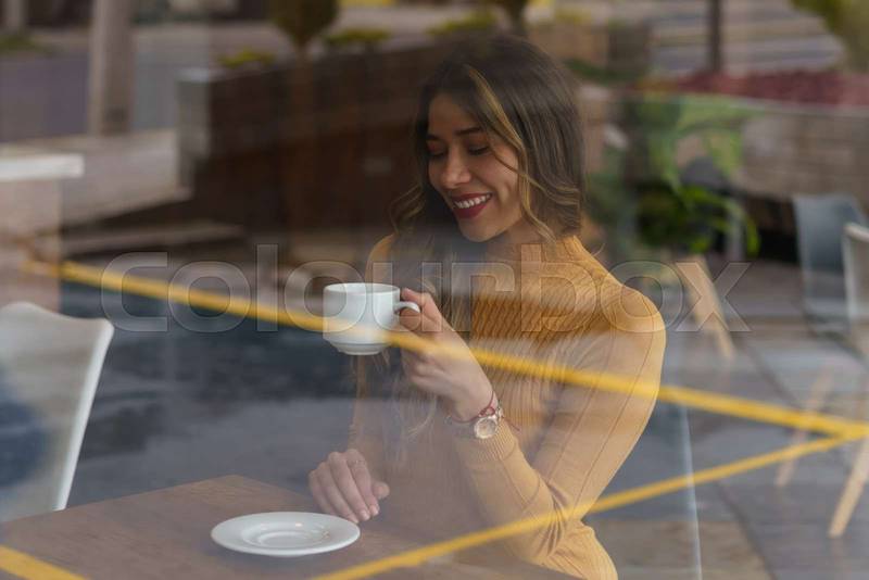 woman with long hair having cup of coffee as breakfast, lifestyle and rest