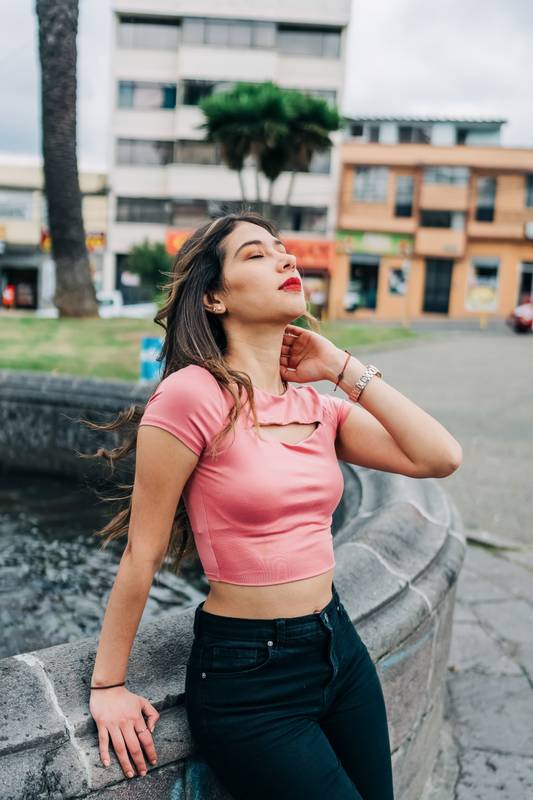 woman standing enjoying the sun in the day