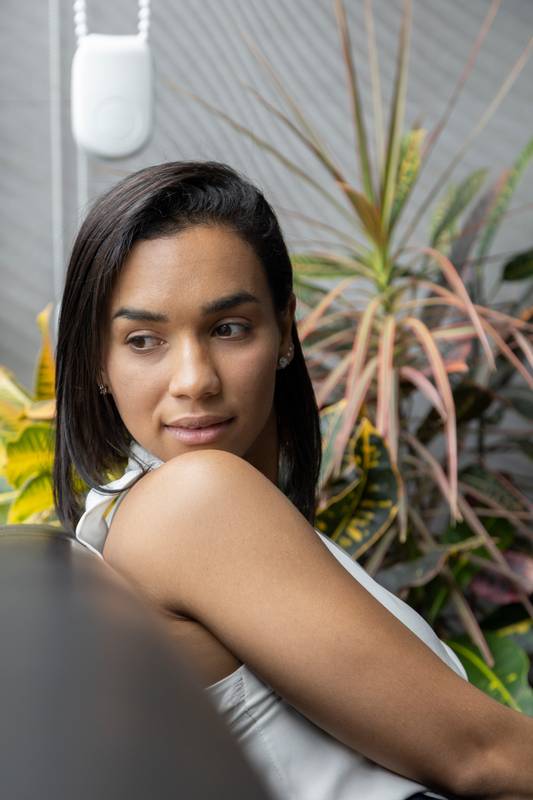 face of beautiful young latin woman colorful plants, studio and beauty
