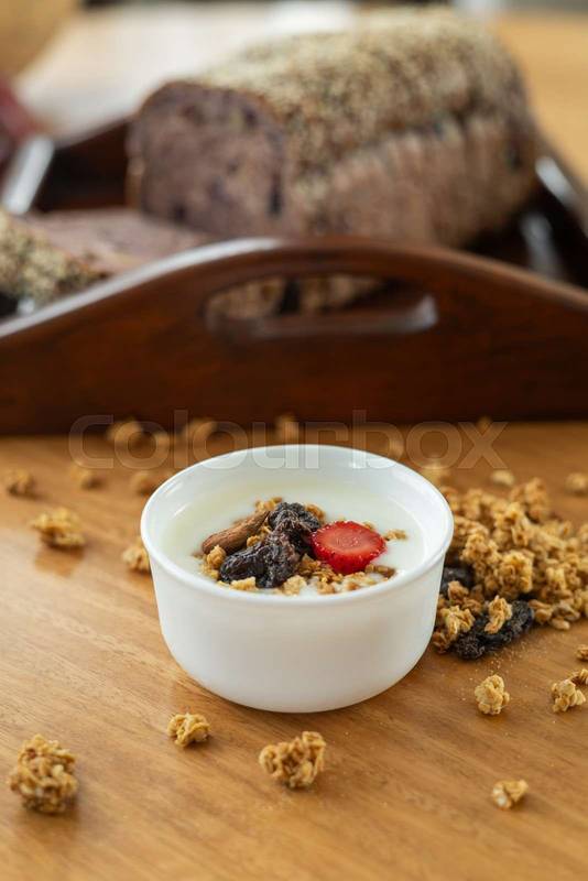 portion of fresh fruit, carefully arranged on an elegant wooden tray, breakfast
