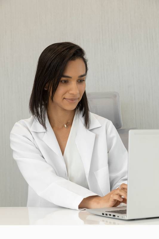 medical office, latin doctor  wearing a white uniform coat, medicine