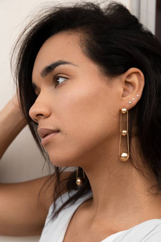face of a young latin woman with short hair, detail of her natural beauty