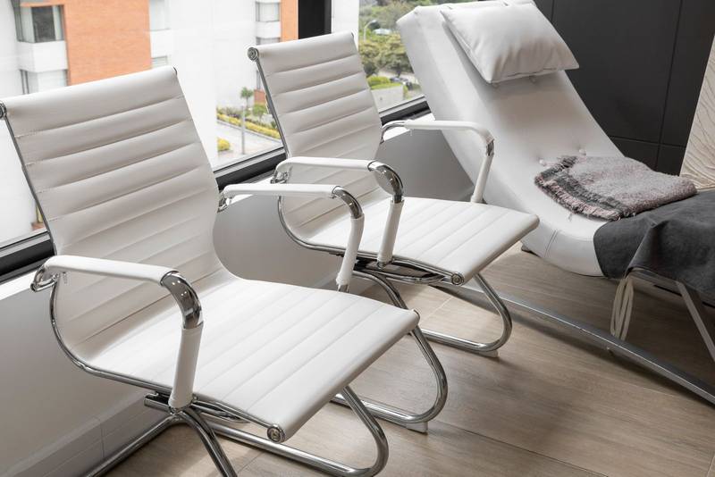 white modern leather chairs, furniture in the office interior