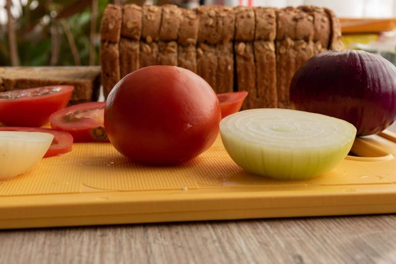 fresh vegetables cut into slices, food preparation with organic ingredients