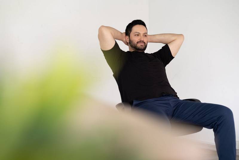 A serene pause framed by soft greens evokes mindfulness, balance