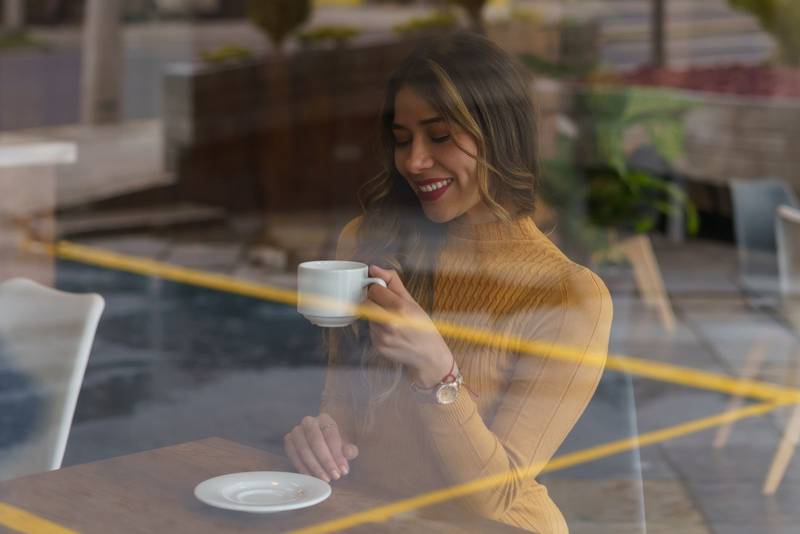 woman with long hair having cup of coffee as breakfast, lifestyle and rest