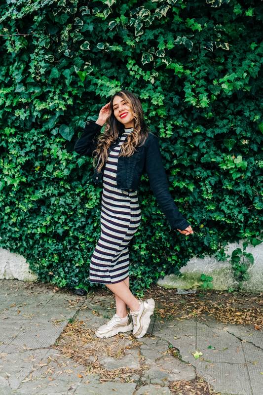 outdoor full body shot of slim, young latin woman