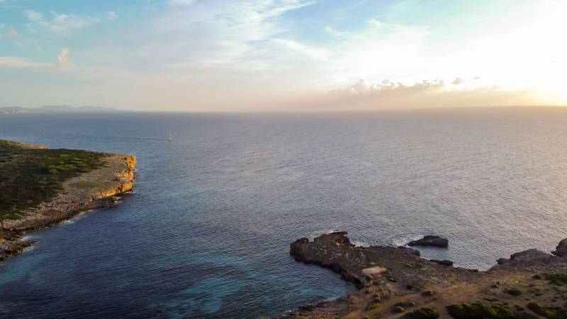 aerial drone view of the mediterranean coast at sunrise in portocolom, Majorca, balearic islands